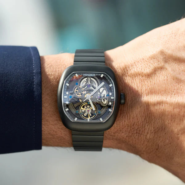 Luxury skeleton watch with carbon fiber case, bold motorsport design, and intricate mechanical movement on wrist