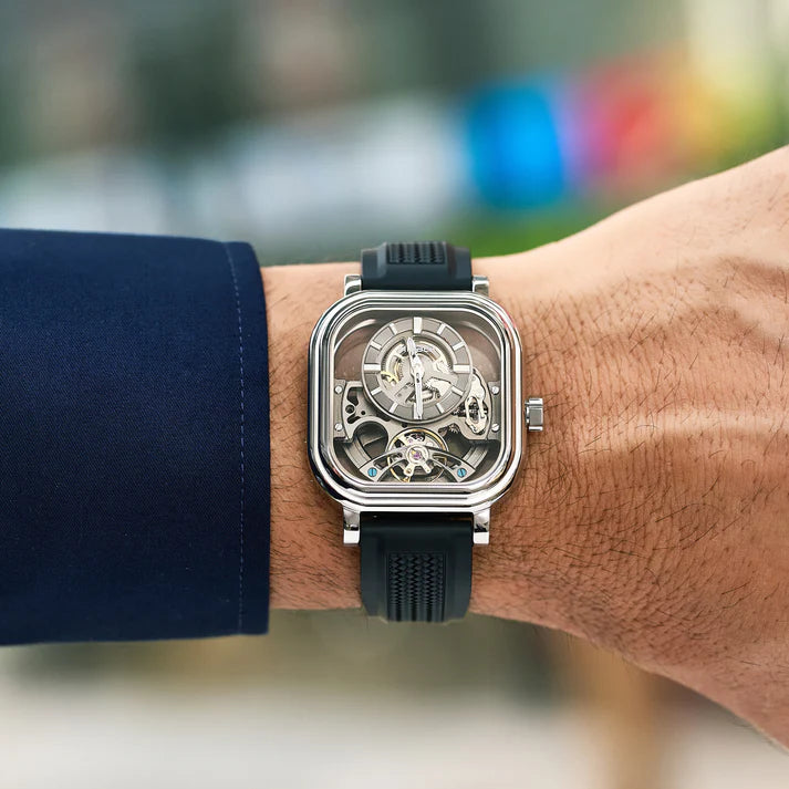 Luxury skeleton watch with bold square case, carbon fiber strap, inspired by motorsport design for everyday wear.