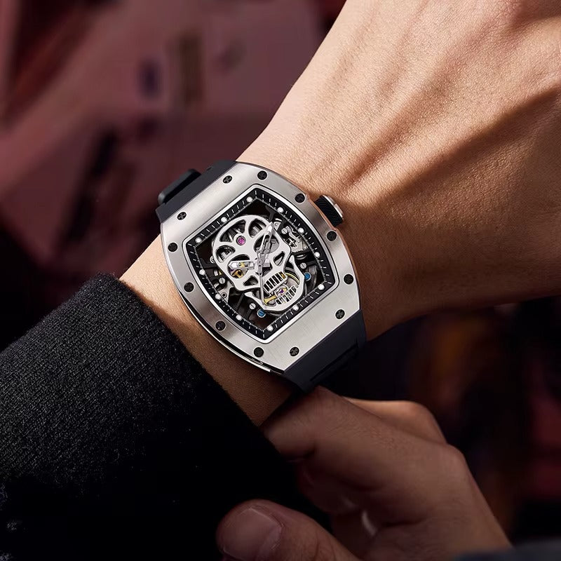 Skeleton dial racing-inspired sport luxury watch with tonneau case and black strap on wrist