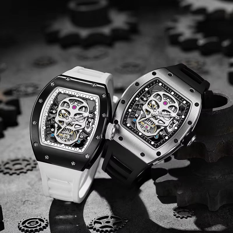 Two sport-luxury skeleton watches with skull dials, bold cases, black and white straps, racing-inspired design