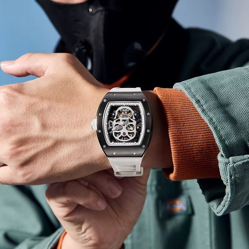Motorsport-inspired luxury skeleton watch with white rubber strap and bold tonneau case