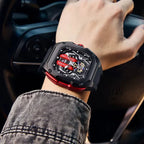 Luxury racing-inspired skeleton watch with red accents, worn on wrist, sport-luxury style