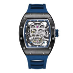 Motorsport-inspired luxury watch with blue strap and skeleton dial featuring a bold skull design