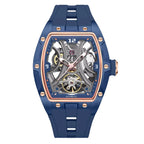 Blue tonneau-shaped skeleton automatic watch with visible movement, gold accents, sporty luxury style