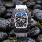 Carbon fiber skeleton watch with bold motorsport design, inspired by luxury chronographs, on wet stones