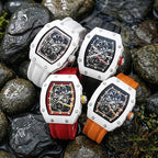 Luxury sport chronograph watches with carbon fiber cases, bold straps, and skeleton dials on wet rocks.