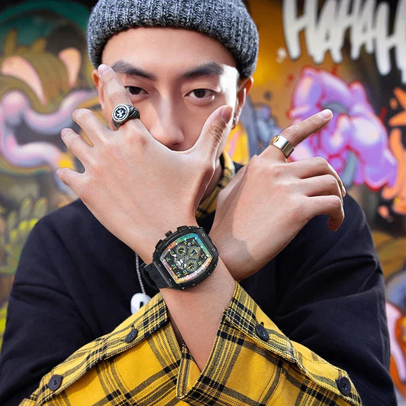 Man wearing a bold sport-luxury watch with exposed movement and racing-inspired design, urban style