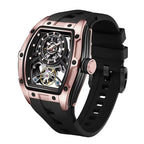 Luxury sport-inspired skeleton watch with rose gold case and black rubber strap