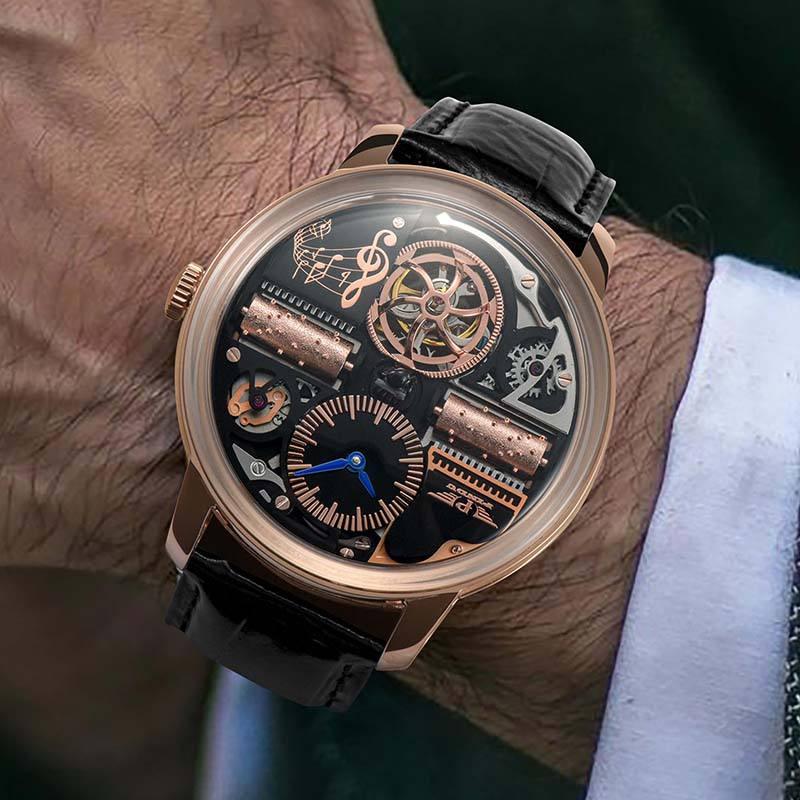 Luxury skeleton dial watch with rose gold case and black leather strap, inspired by motorsport