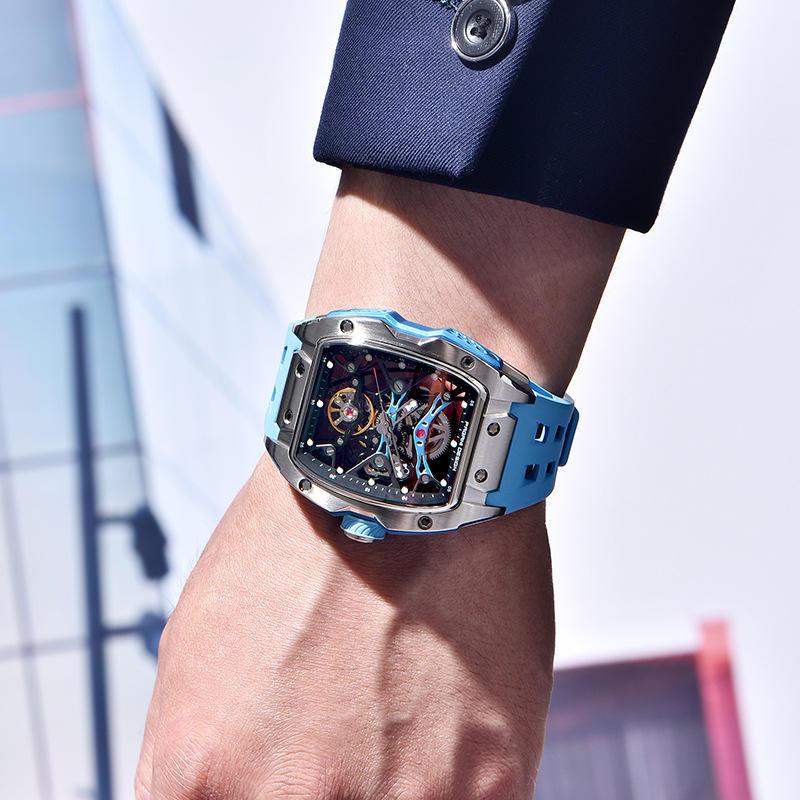 Luxury sport-luxury watch with blue strap and skeleton dial, motorsport-inspired on wrist