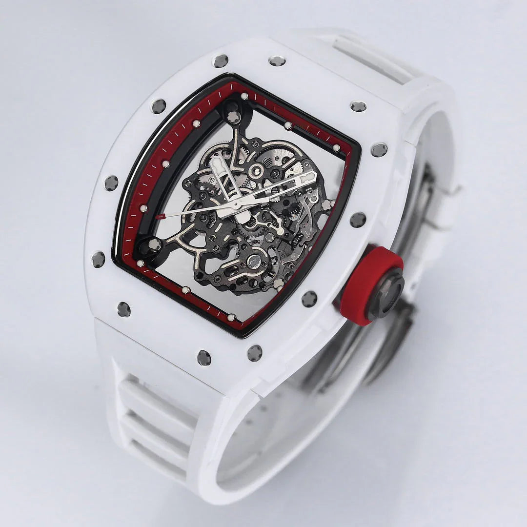 White racing-inspired skeleton watch with tonneau case, red crown, and exposed movement.