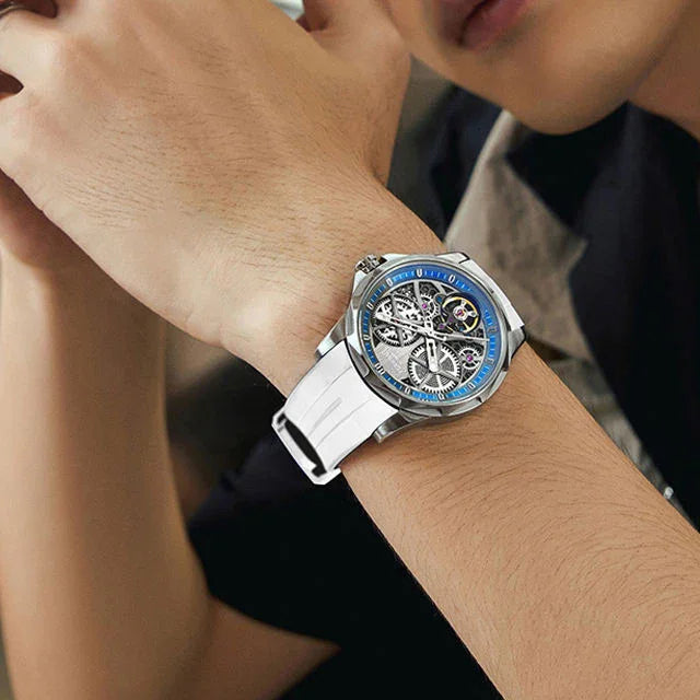 Luxury racing-inspired skeleton watch with white strap and blue bezel on wrist