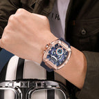 Racing-inspired luxury men's watch with blue dial, rose gold case, and chronograph details on wrist