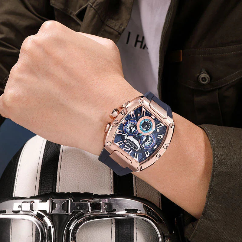 Racing-inspired luxury men's watch with blue dial, rose gold case, and chronograph details on wrist