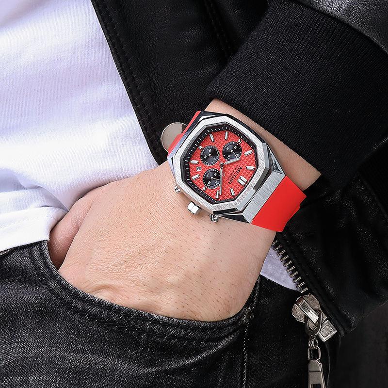 Motorsport-inspired red chronograph watch with hexagonal case and sporty red strap on wrist