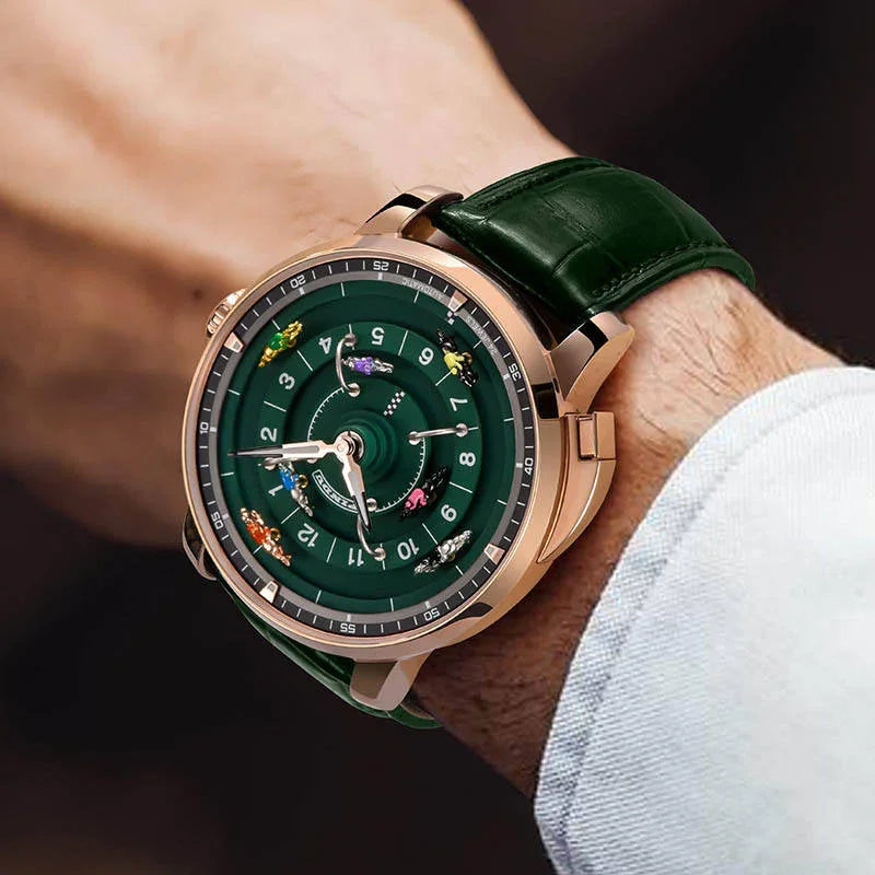 Luxury motorsport-inspired watch with green dial, rose gold case, and racing miniatures on wrist