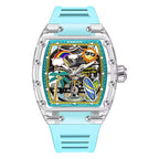Colorful tonneau-shaped sport-luxury watch with beach motifs, blue strap, transparent case