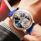 Luxury motorsport-inspired watch with blue leather strap, skeleton dial, rose gold case.