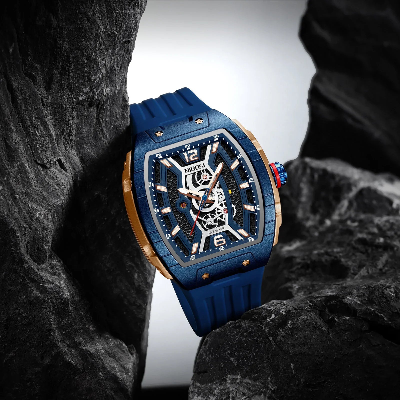 Blue and gold racing-inspired luxury watch with skeleton dial, sporty strap, bold design