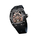Luxury motorsport-inspired skeleton watch with black case, gold accents, and sporty rubber strap