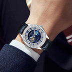 Luxury sport-inspired wristwatch with blue starry dial, diamond bezel, and black leather strap.