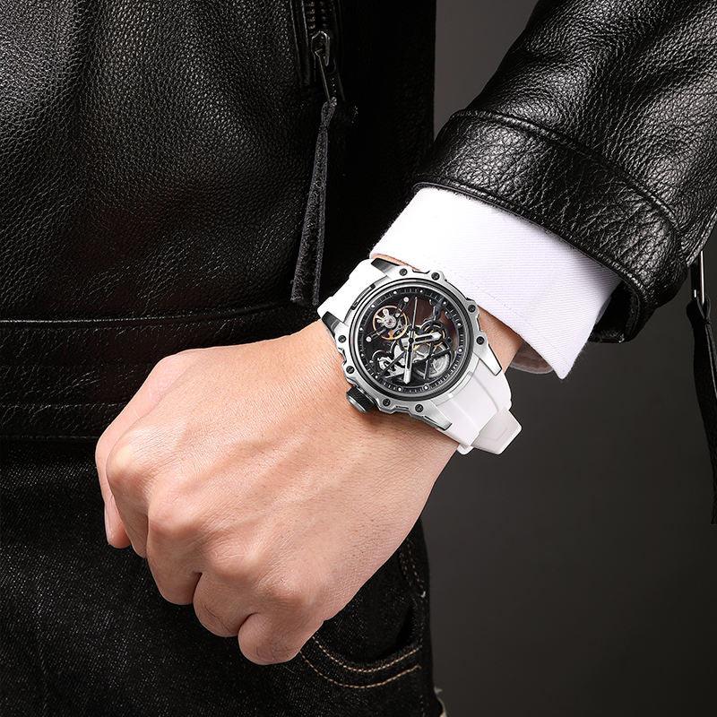 Motorsport-inspired skeleton dial watch with white strap on wrist, bold sporty design