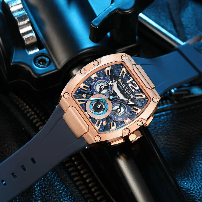Luxury motorsport-inspired chronograph watch with rose gold case, blue dial, and rubber strap
