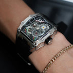 Motorsport-inspired luxury chronograph watch with bold skeleton dial and stainless case on wrist