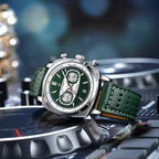 Green dial chronograph watch with perforated leather strap, motorsport-inspired luxury timepiece