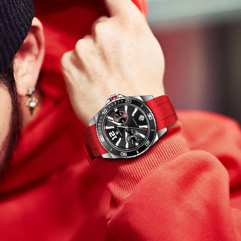 Motorsport-inspired sport-luxury watch with red band, bold dial, and chronograph design on wrist