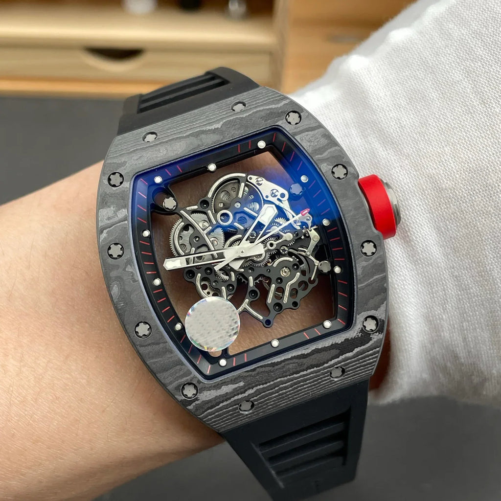 Luxury motorsport-inspired skeleton watch with carbon fiber case, red crown, and black strap