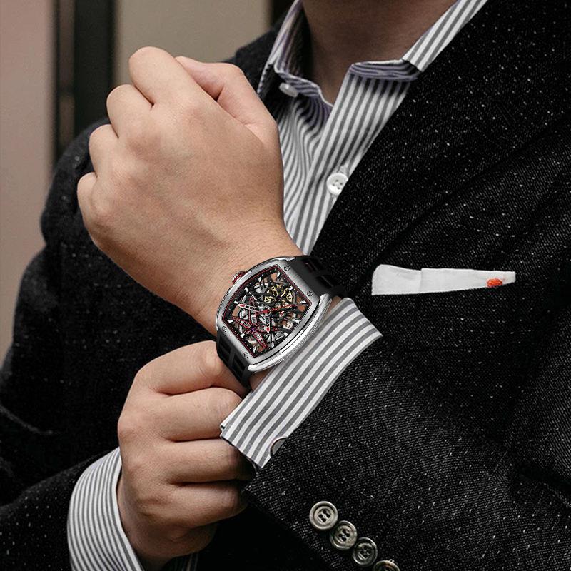 Man wearing motorsport-inspired skeleton dial luxury watch with rubber strap and bold case