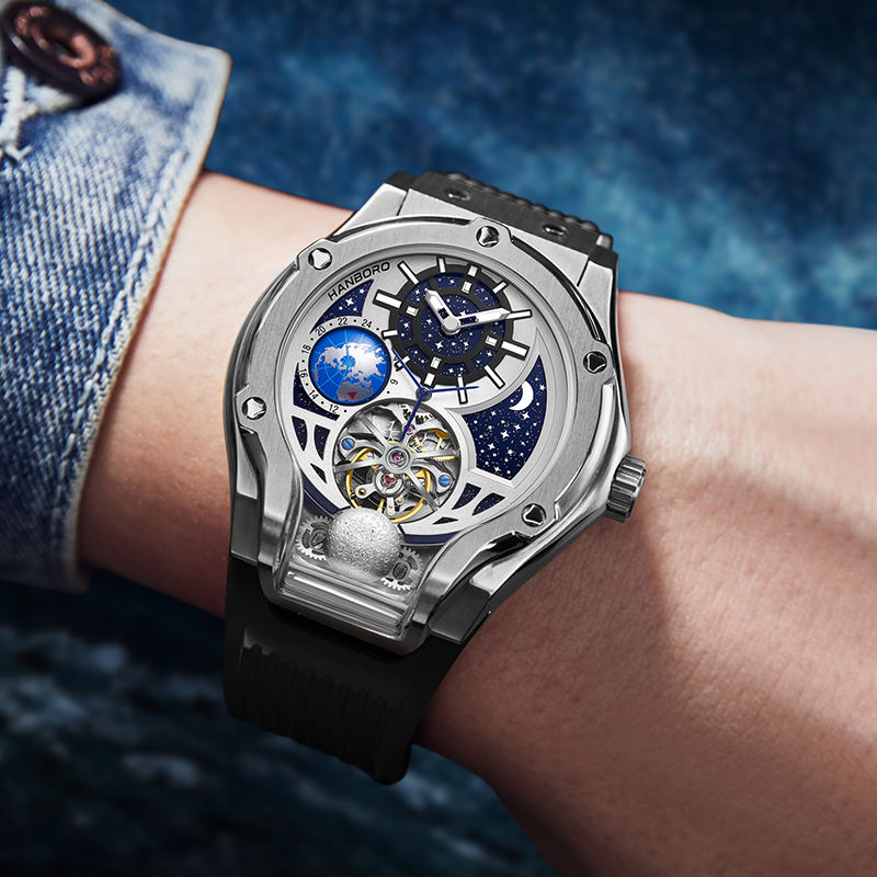 Luxury motorsport-inspired skeleton watch with moonphase dial, open gears, and starry accents on wrist