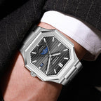 Luxury silver racing-inspired watch with octagonal case and striped black dial on wrist