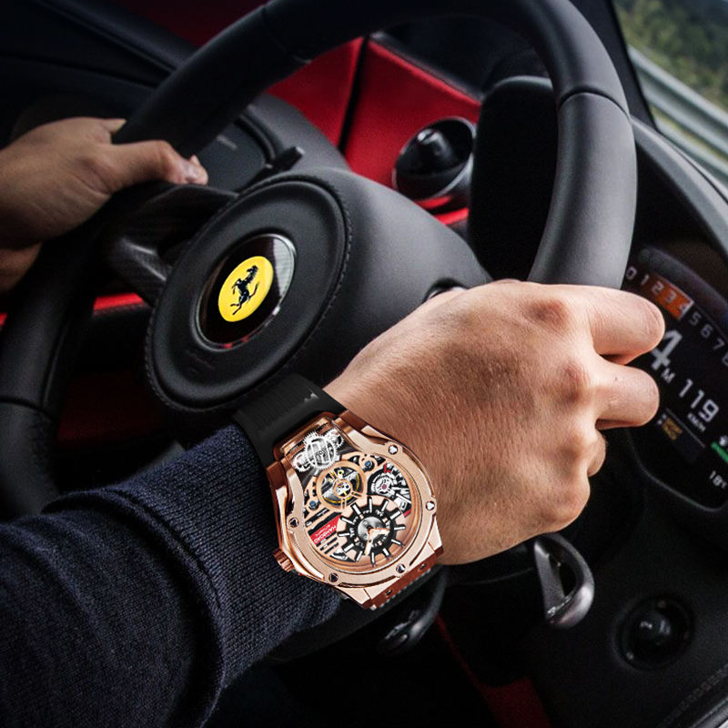 Motorsport-inspired luxury skeleton watch with rose gold case on wrist driving a sports car