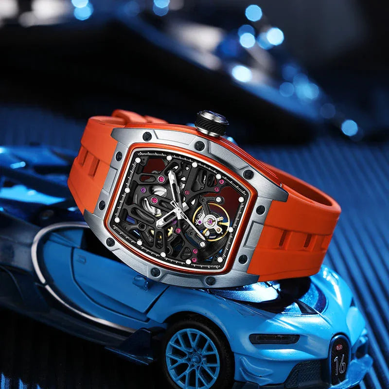 Motorsport-inspired luxury skeleton watch with orange strap on blue race car model