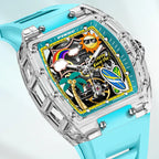 Motorsport-inspired luxury watch with clear case, playful tropical dial, and blue strap