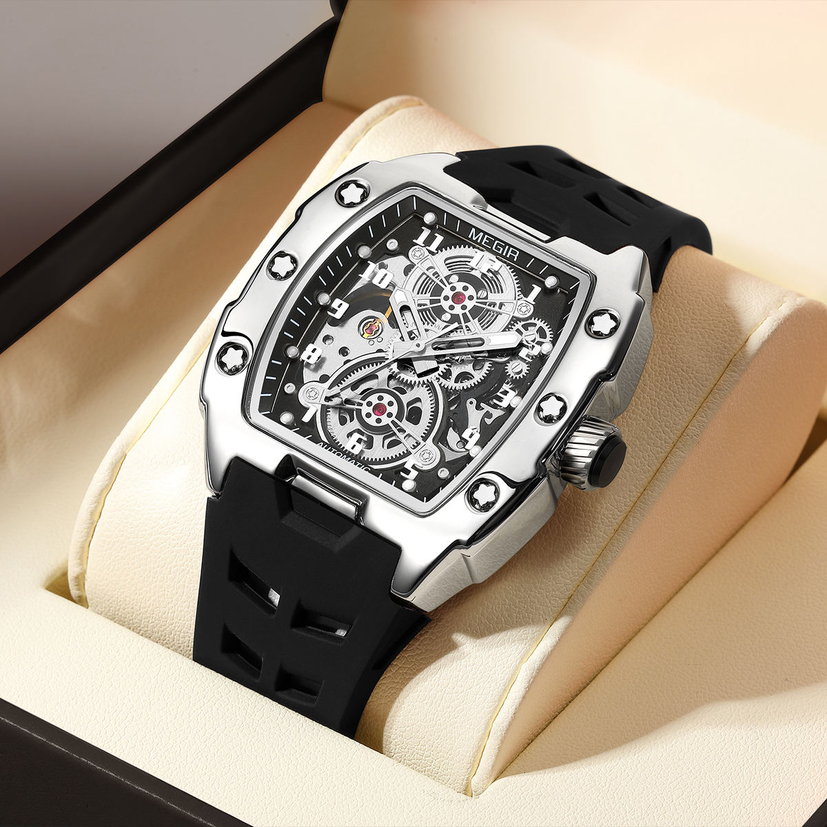 Luxury racing-inspired skeleton watch with tonneau case, black strap, and visible gears in display box