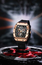 Luxury motorsport-inspired skeleton watch with rose gold case and black rubber strap on gear