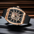Luxury motorsport-inspired rose gold tonneau watch with skeleton dial and black rubber strap