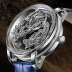 Luxury skeleton watch with silver 3D dragon design, blue leather strap, motorsport-inspired style