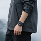 Motorsport-inspired black sport-luxury watch with bold design on wrist, outdoor setting