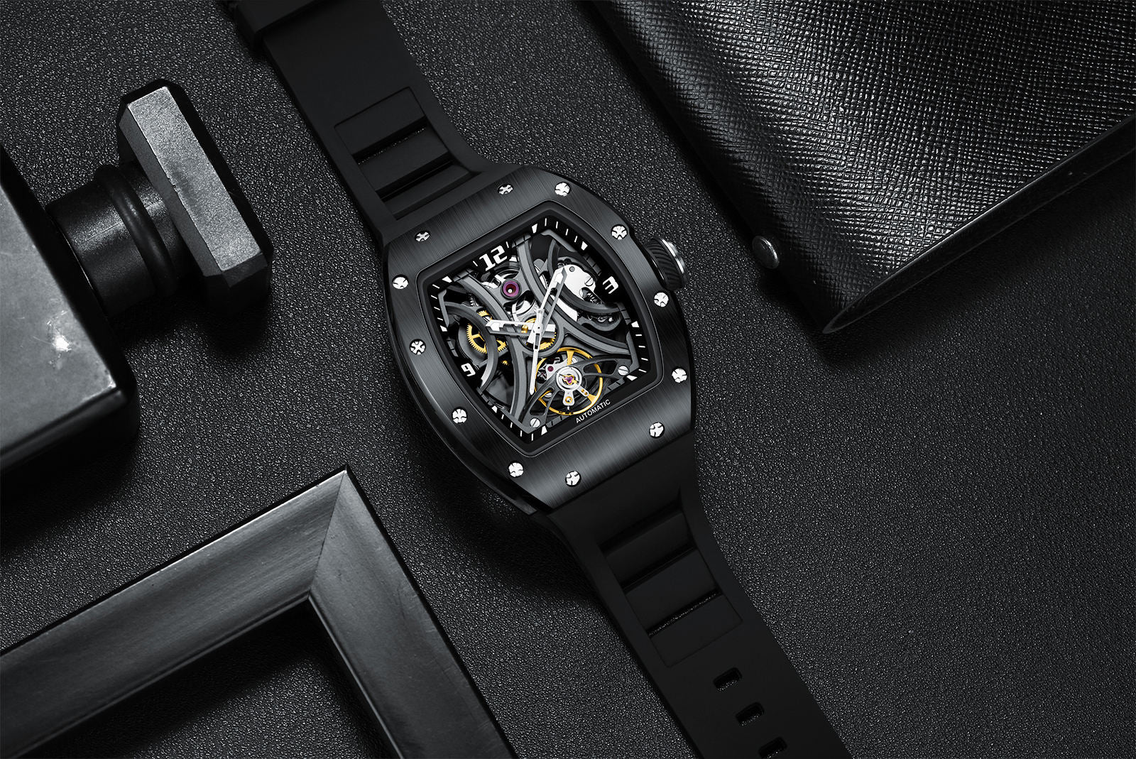 Skeleton dial sport-luxury watch with black rubber strap and brushed case, motorsport-inspired design