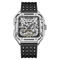 Skeleton dial sports watch with square silver case, black rubber strap, and visible mechanical movement.