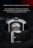 Luxury motorsport-inspired watch with transparent case back displaying mechanical movement and black rubber strap