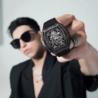 Man holding bold skeleton dial sport-luxury watch with black case, motorsport-inspired design