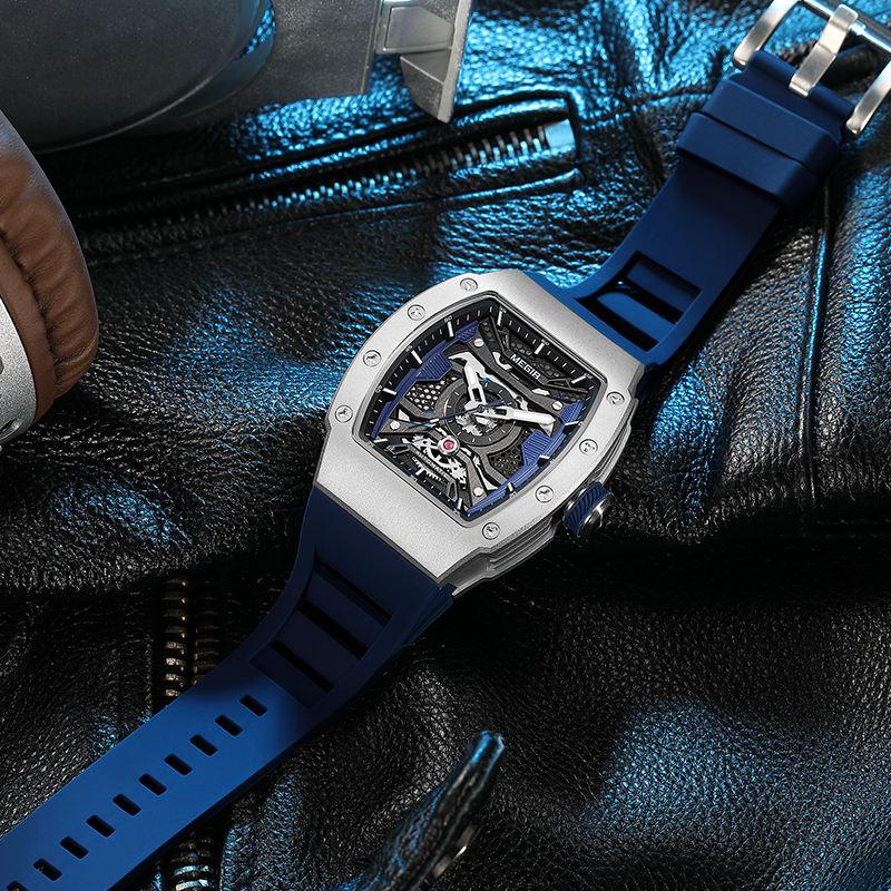 Luxury motorsport-inspired watch with blue strap and skeleton dial on black leather